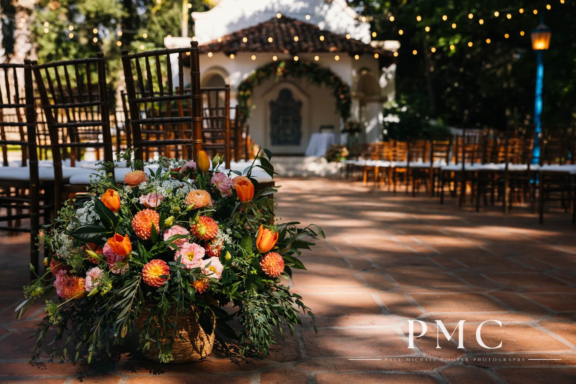 Florals and chairs set up at the ceremony site at Rancho Las Lomas wedding venue in Orange County.