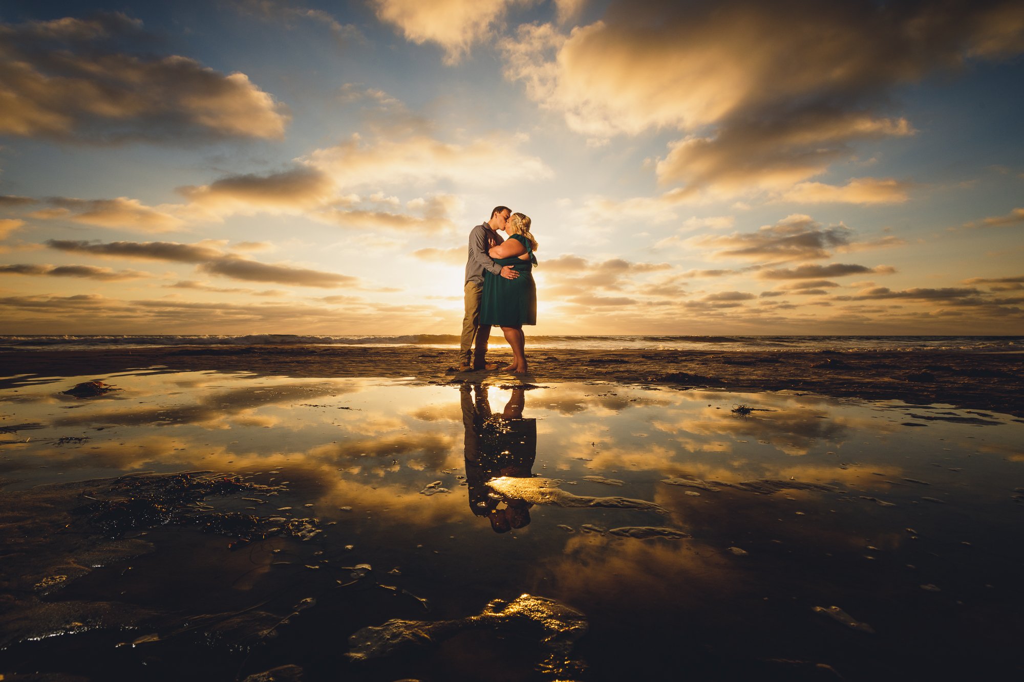 Best Wedding Photographer in San Diego - Cinematic Engagement Photography - Couple Kissing at Torrey Pines State Nature Reserve and Beach