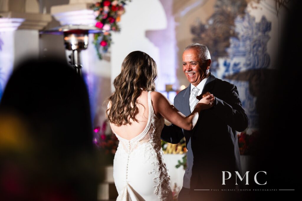 A bride shares a sweet father-daughter dance at her outdoor wedding reception.
