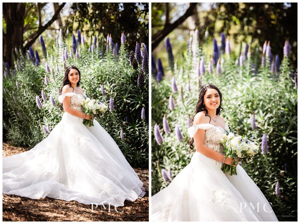 A bride smiles with her floral bouquet among the foliage and flowers at The Heights Golf Club.