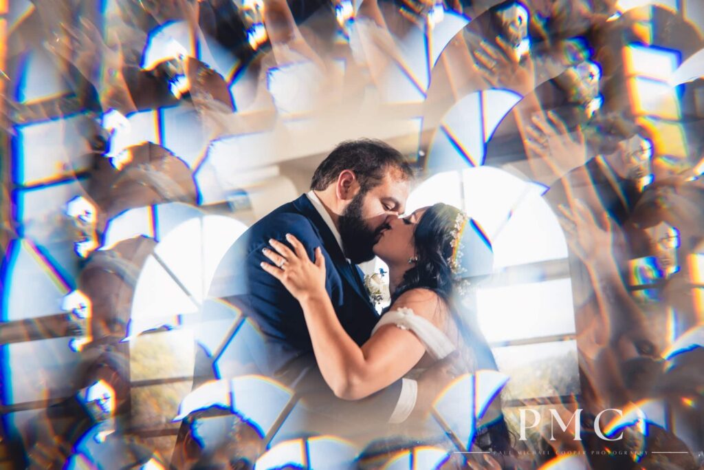 A bride and groom kiss during their First Dance at their wedding reception at the Heights Golf Course.