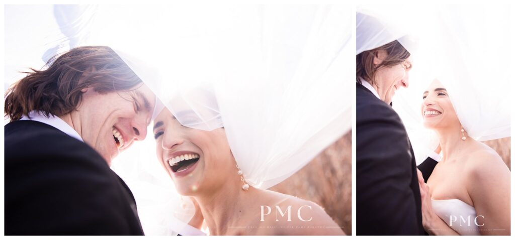 A bride and groom smile and laugh beneath her veil on their wedding day at Mammoth Mountain.