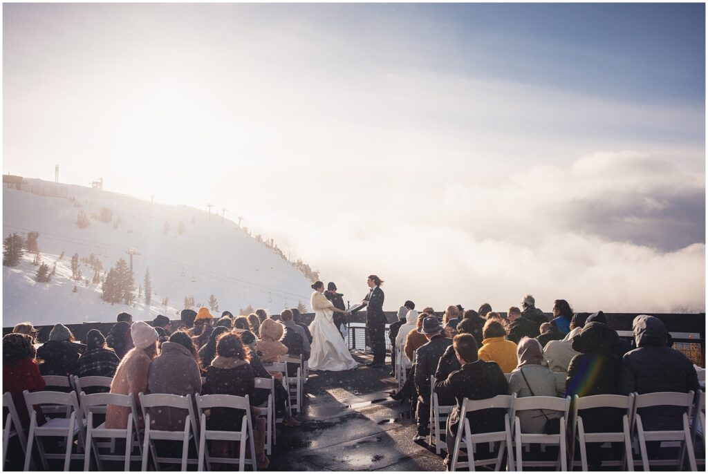 Scenic photo of a destination wedding ceremony in the snow on Mammoth Mountain.