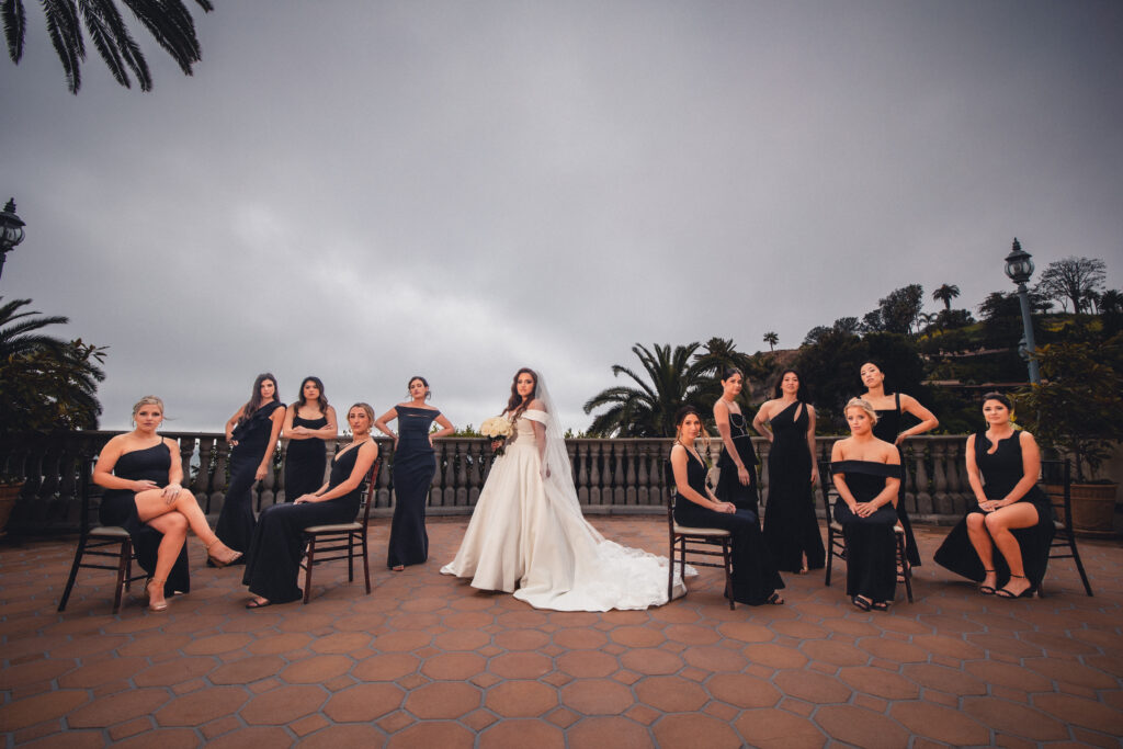 A bride and her bridesmaids strike a Vogue pose at a Bel-Air Bay Club wedding.