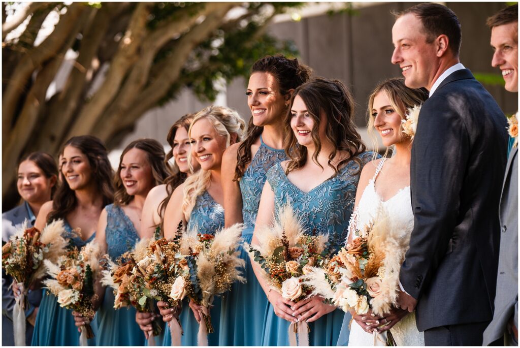 A wedding party in Carlsbad poses for a group photo.