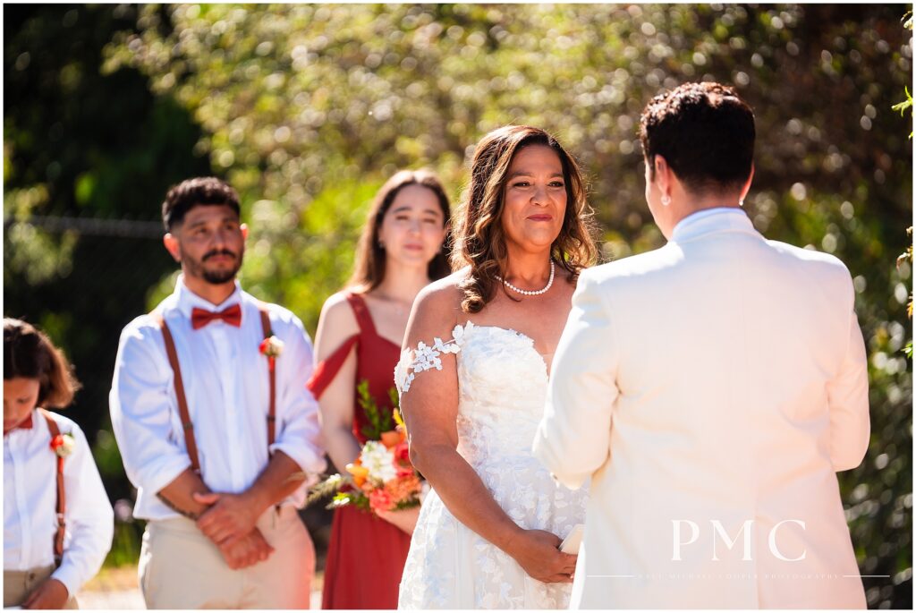 Two brides celebrate their terracotta-themed summer wedding at the historical Rancho Minerva Wedding Venue in Vista.