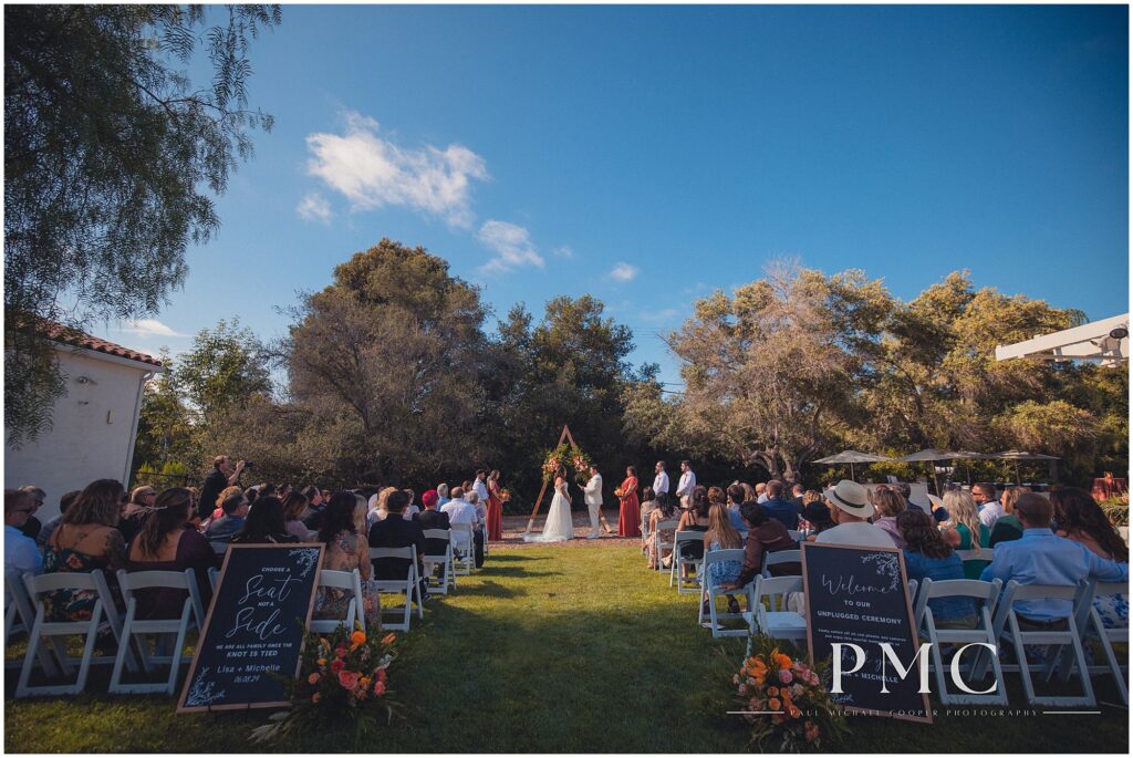 Two brides celebrate their terracotta-themed summer wedding at the historical Rancho Minerva Wedding Venue in Vista.