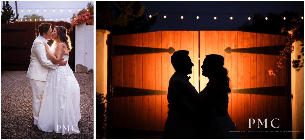 Two brides share a romantic moment in front of the iconic wooden gates at the historical Rancho Minerva Wedding Venue.