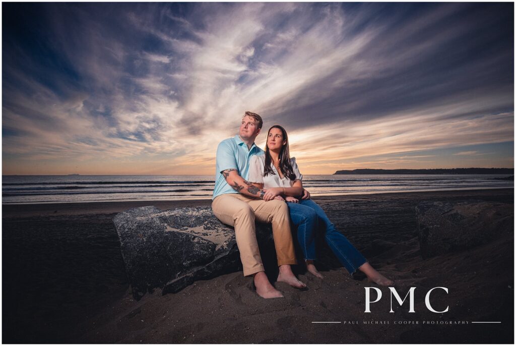 Cinematic engagement photo on Coronado Beach, San Diego.